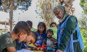 A UNICEF-supported teacher provides children with psychosocial support sessions at an integrated learning centre in east rural Aleppo, Syria.